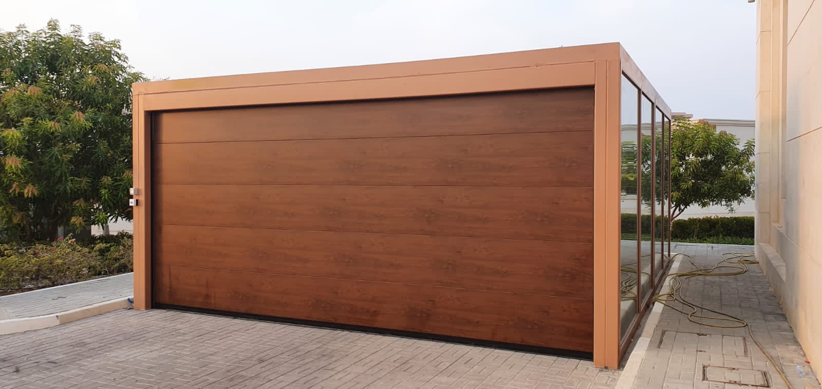 Wood Color Overhead Door - باب كراج لون خشبي - BAB ALSARAY AUTOMATIC GATES & BARRIERS TRADING LLC