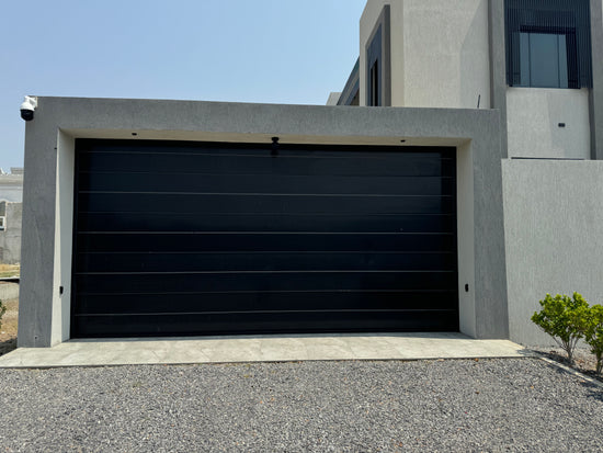 Close-up of DOCO door tracks and brackets installed in a UAE villa garage door project